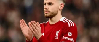 Liverpool sweat as Conor Bradley leaves Emirates on crutches after knee scare